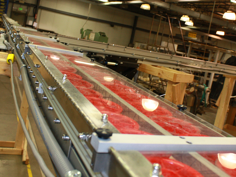 Sorting and conveyor system moves parts 14 feet above the floor