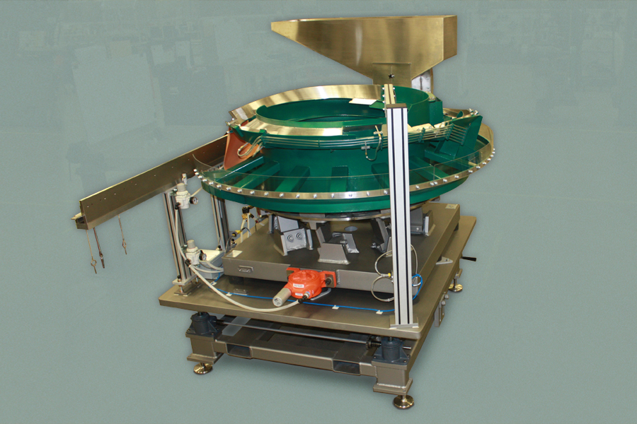 Cap feeder for combustible products